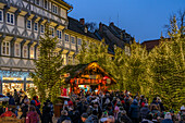  Christmas market and Christmas forest in the old town of Goslar at dusk, Lower Saxony, Germany  