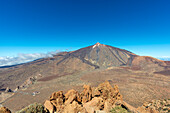  Panorama during the ascent to the Alto de Guajara, 2715m, to the bizarrely shaped rock formations made of volcanic rock, Roques de García, the visitor center and the Hotel Parador, behind it the Pico del Teide, 3717m, at sunrise, Teide National Park, Parque Nacional del Teide, Tenerife, Canary Islands, Spain, Europe 