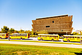  National Museum of African American History and Culture and school buses at the National Mall and Memorial Parks in Washington DC, District of Columbia, USA 