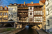  The medieval Krämerbrücke bridge with half-timbered houses over the river Gera in Erfurt, Thuringia, Germany  