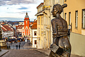  Bronze sculpture of Duchess Luise Dorothea of Saxe-Gotha-Altenburg in front of the main market with the old town hall in Gotha, Thuringia, Germany  