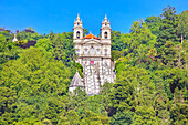 View of Bom Jesus do Monte santuary immersed in the greenery of the surrounding woods, Braga, Minho Province, Portugal