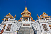 Exterior view of the Wat Traimit Temple on a bright sunny day. Bangkok, Thailand.