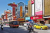 Street traffic on Yaowarat Road on a bright sunny day. Chinatown, Bangkok, Thailand.