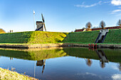  Moat and post mill of the inhabited former fortress Bourtange, Groningen, Netherlands  