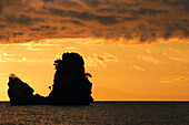 A rocky islet off the Tanjung Rhu beach at sunset. Langkawi island, Malaysia.