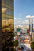 Aerial view of the Bukit Bintang district from a rooftop of a high-rise building. Kuala Lumpur, Malaysia.