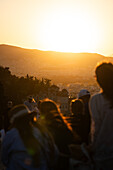 People on the Acropolis at sunset, Athens, Greece