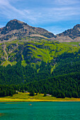Beautiful Alpine Lake Silvaplana with Mountain View in the Swiss Alps in a Sunny Summer Day in Silvaplana, Maloja, Grisons, Switzerland.