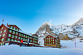 The Famous and Historical Hotel Bellevue des Alpes at 2061 Meters High Up and Mountain Peak of North Face of Eiger 3907 Meter High in a Sunny Winter Day in Kleine Scheidegg, Grindelwald, Canton Bern, Switzerland.