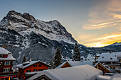 Snowcapped Mountain Peak Eiger at 3970 Meter High and Village Grindelwald in Sunset in a Beautiful Winter Day in Grindelwald, Canton Bern, Switzerland.