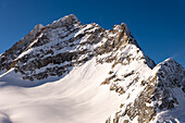 Beautiful Mountain Peak Jungfrau 4158 Meters High and Aletsch Glacier in a Sunny Winter Day with Snowcapped with Sunlight in Berner Oberland, Grindelwald, Canton Bern, Canton Valais, Switzerland.