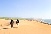 People walking on dunes around Tamri on Atlantic Coast, between Agadir and Essaouira,Morocco,North Africa