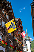 Beautiful City Street in Old Town with Houses and Hotel and with Mountain in a Sunny Summer Day in Andermatt, Uri, Switzerland.
