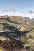  View into a forested valley in Peneda Geres National Park. Cloud shadows, Gavieria, Viana do Castelo, Portugal 