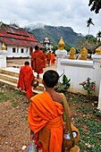Back at monastery after Tak Bat or the Buddhist monk's morning collection of food, Nong Khiaw, Luang Prabang Province, Laos, Southeast Asia
