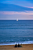 Sunset at Barceloneta Beach, Barcelona, Catalonia, Spain.