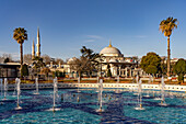  Fountain in Sultan Ahmet Park and the Sultanahmet Madrasa in Istanbul, Türkiye  