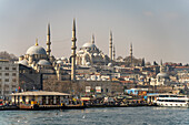  The New Mosque Yeni Cami and the Suleymaniye Mosque in Eminonu, Istanbul, Türkiye  