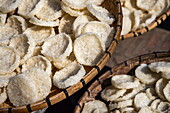  Traditional dried rice crackers for sale outside the Buddhist temple Wat Xiengthong, Luang Prabang, Luang Prabang District, Luang Prabang, Laos, Asia 