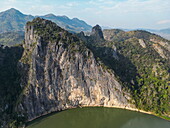  Aerial view of sea kayakers passing a mountain along the Nam Ou River, Pak Ou, Pak Ou District, Luang Prabang, Laos, Asia 