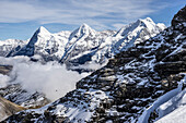  The Schilthorn cable car above the fog. Behind it rise the Eiger, Mönch, and Jungfrau, Mürren, Bernese Oberland, Switzerland 