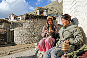 Villagers warming up in the sun at Rumbak village,Hemis National Park,Ladakh region, state of Jammu and Kashmir,India,Asia