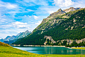 Beautiful Alpine Lake Silvaplana with Mountain View in the Swiss Alps in a Sunny Summer Day in Silvaplana, Maloja, Grisons, Switzerland.