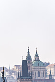 View of the Old Prague areas from the top in misty morning