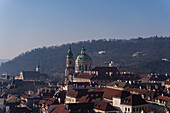 View of the Old Prague areas from the top in misty morning