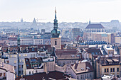 View of the Old Prague areas from the top in misty morning