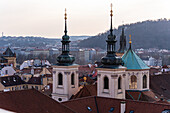 View of the Old Prague areas from the top in misty morning
