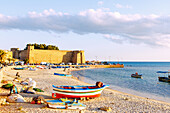  Beach with fishing boats in front of the Kasbah and Medina in Hammamet, Tunisia 