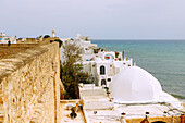 View from the Kasbah (castle) of the roofs of the old town, the lighthouse and the Mediterranean Sea in Hammamet, Tunisia 