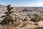  View from Philopappos Hill of the sea of houses in the Greek capital Athens, Greece  