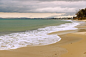  Sandy beach Plage Les Citronniers with view of Yasmine Hammame during approaching storm, Hammamet, Tunisia 
