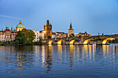  Prague Old Town with Vltava River, Charles Bridge and Old Town Bridge Tower at dusk, Prague, Czech Republic 