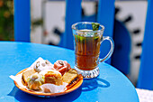  Arabic mint tea with small pastries, served on the terrace of Café Nattes in Sidi Bou Said, Tunisia 