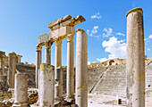  Theater with columns of the stage and tiers, ruins of ancient Thugga at the archaeological site near Dougga, Tunisia 