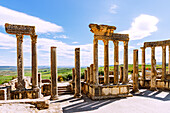  Theater with stage columns and view, ruins of ancient Thugga at the archaeological site near Dougga, Tunisia 