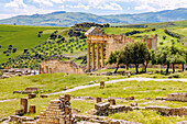  Capitol with temple in honor of Jupiter, Juno and Minerva, and forum, ruins of ancient Thugga at the archaeological site near Dougga, Tunisia 