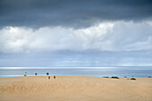  People in the distance on the sand dunes in the &quot;Parque Natural de Corralejo&quot;, Fuerteventura, Canary Islands, Spain, Europe 