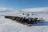  Winter camp with tents in the snow at Mohnbukta, Svalbard, Norway 