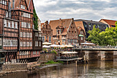  Half-timbered houses of the Stintmarkt pub district at Lüneburg harbor, Hanseatic City of Lüneburg, Lower Saxony, Germany 