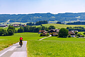  Cycle path and cyclists in the Salzkammergut cycling region from Oberndorf near Salzburg through the Oichental to Nußdorf am Haunsberg, Salzburger Land, Austria 
