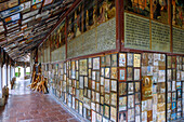  Open gallery of the Chapel of Grace with votive images and wooden crosses in Altötting, Upper Bavaria, Bavaria, Germany 