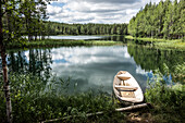  Fishing boat on a small lake near Jokkmokk, Norrbotten County, Sweden 