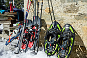  Snowshoes and hiking poles at the Rifugio Saoseo, Val da Camp, Livigno Alps, Graubünden, Switzerland 