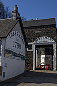  Entrance gate and reception building of the Tobermory Distillery on Mull. 