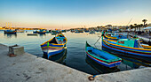  Colorful fishing boats in the harbor of Marsaxlokk, Malta, Europe 